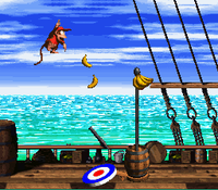 Diddy collects bananas in Donkey Kong Country 2.