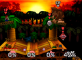 Giant Donkey Kong being fought in Super Smash Bros. by human player Mario and allies Jigglypuff and Kirby.