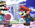 Mario throws a Gooey Bomb that sticks to Wario.