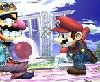 Mario throws a Gooey Bomb that sticks to Wario.