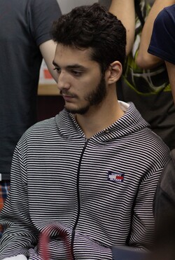 Due to a confusion, now the photo of the Japanese player Red is the following one: https://www.ssbwiki.com/File:Red_(Japan).jpg