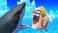 Wario using Chomp near a shark on the stage.