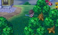A Villager about to chop down a tree in Animal Crossing.