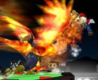 Captain Falcon attacking Fox and Mario on Pokemon Stadium.