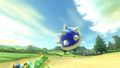 The Spiny Shell in Mario Kart 8 Deluxe, ready to hit the racer in first place.