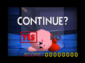 Kirby in his "doll" state on the Continue screen.