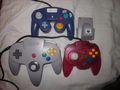 Size comparisons between a N64, Hori Mini Pad, and GameCube controllers.