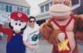 Slamfest '99 producer Ed Espinoza posing with Mario and DK outside the ring.